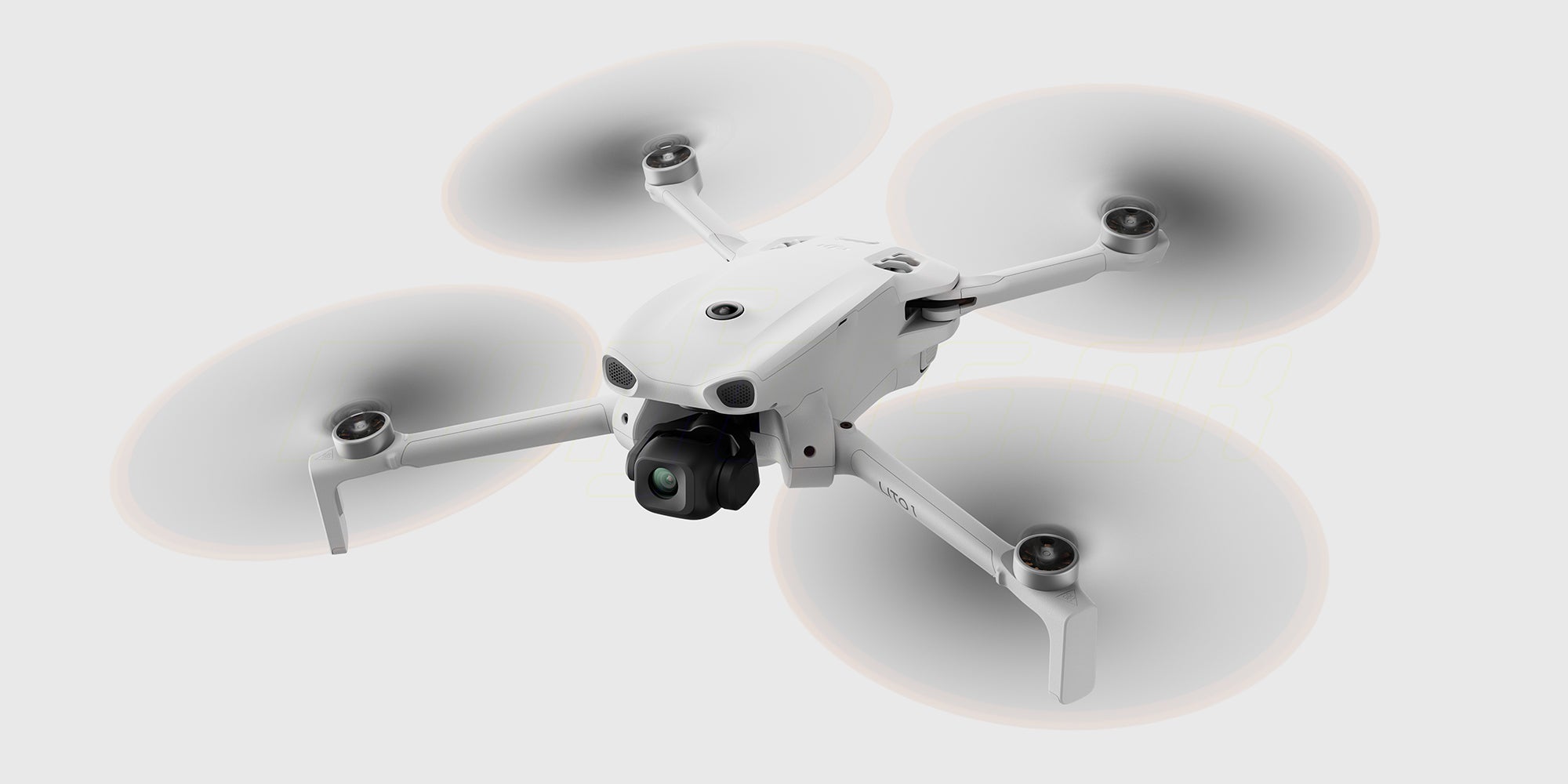 DJI Lito 1 der flyver i luften set forfra på hvid baggrund 