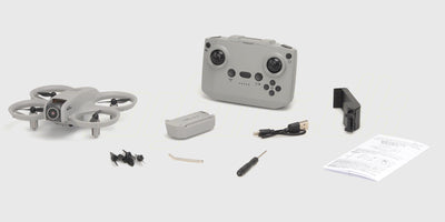 Sort Drone GT3 i original emballage med tilhørende fjernbetjening og ekstra propeller til begyndere.