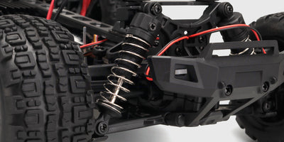 Nærbillede af de justerbare støddæmpere og affjedring på en Hunter MT10 fjernstyret bil.