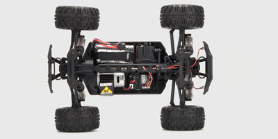 Nærbillede af Hunter MT10 RC-chassis uden karrosseri, der viser 4-hjulstræk og robust affjedring.