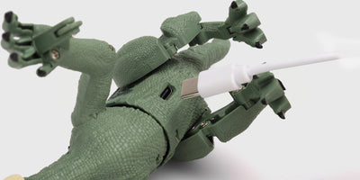 Lille grøn dinosaurus-lampe til børn med USB-C opladning og et blødt hyggeligt lys.