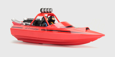 Hvid og blå Storm V8 Superboat fjernstyret speedbåd på vej gennem vandet i høj fart med sprøjt.
