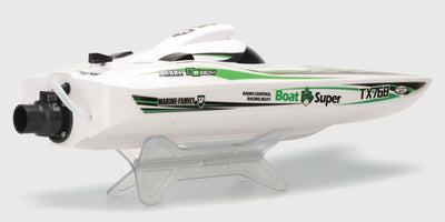 Grøn Super Dino Brushless racingbåd i fuld fart hen over vandet med realistisk vandsprøjt bagfra.