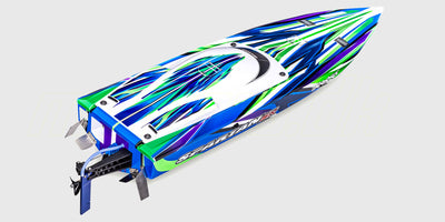 Traxxas Spartan SR brushless racerbåd i orange finish, der planer hurtigt hen over vandoverfladen.