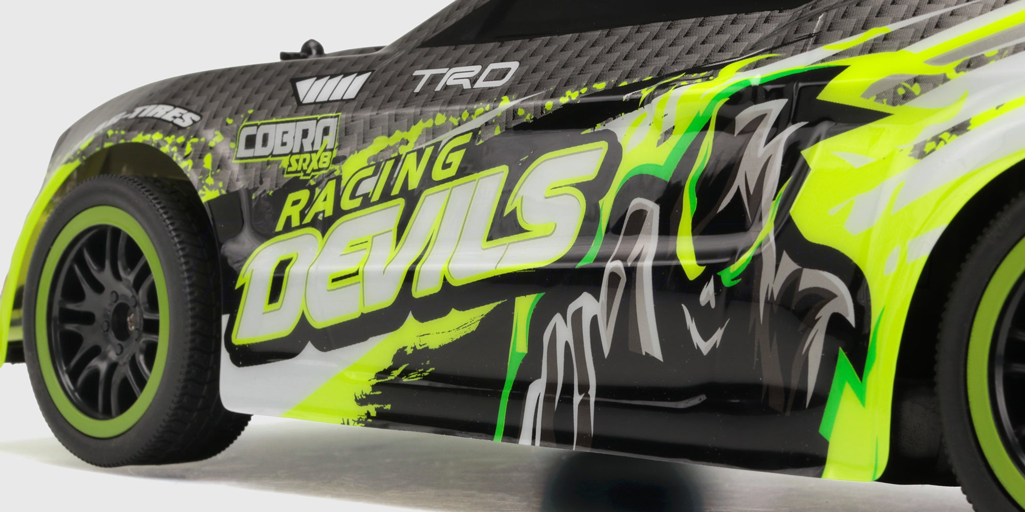 Nærbillede af siden og grafikken på neongrøn Xtreme Racer Rally Sprint
