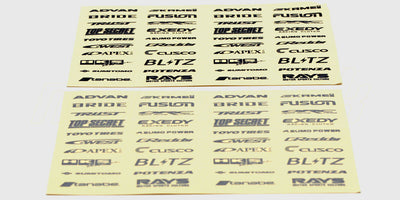 Ark med sorte og sølvfarvede Driftz logo-klistermærker til styling af fjernstyrede biler.